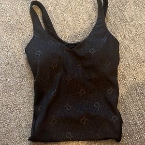 this is a black lululemon align tank with little lululemon signs over it!